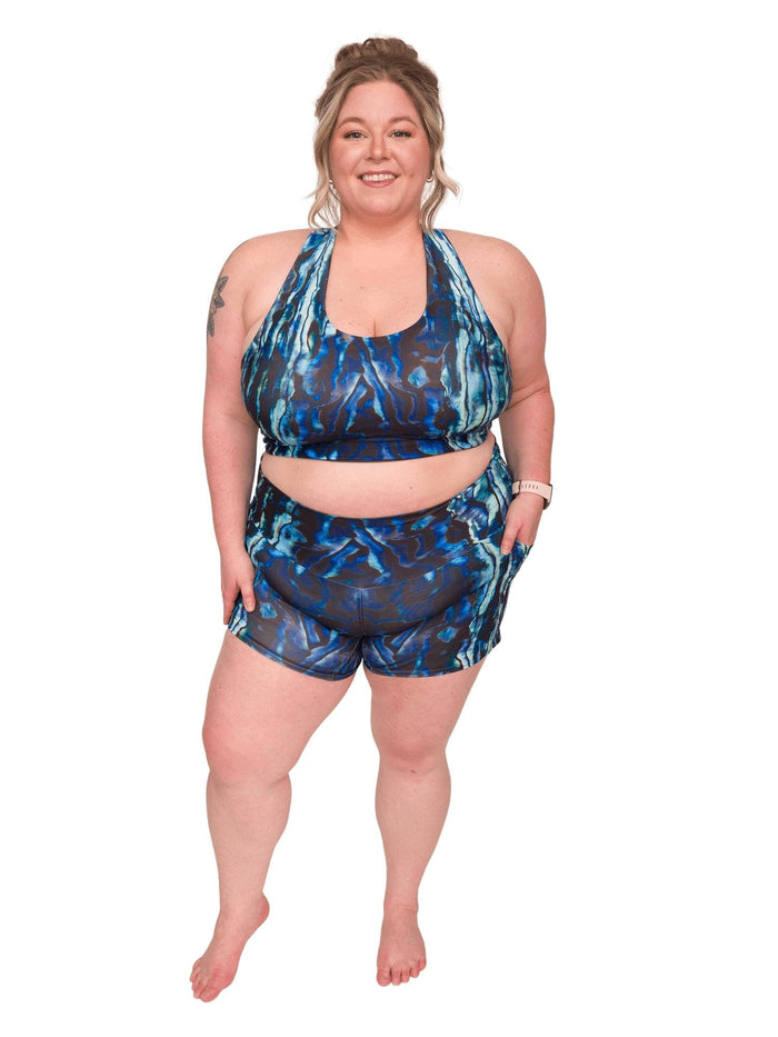 Model: Chelsea is a marine conservationist who believes that science is for everybody… and every BODY! She is 5'2", 230 lbs, 40DD and is wearing 3XL shorts and a 3XL reversible top.