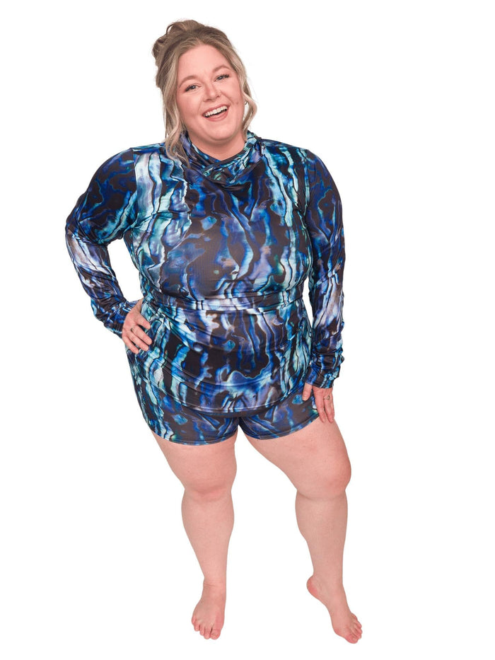 Model: Chelsea is a marine conservationist who believes that science is for everybody… and every BODY! She is 5'2", 230 lbs, 40DD and is wearing 3XL shorts and sun shirt.