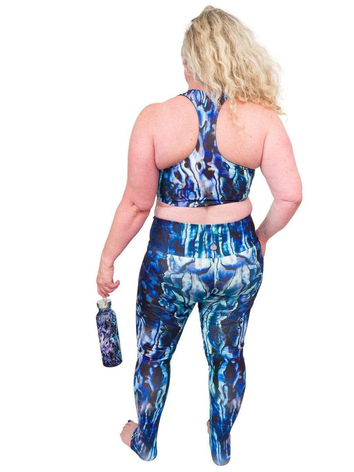 Model: Ruth volunteers for citizen science projects on both salt and freshwater fish and spends as much time as possible in, on, or under the water. She is 5'7", 217 lbs, 40DD and is wearing a 2XL top and legging.