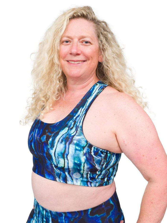 Model: Ruth volunteers for citizen science projects on both salt and freshwater fish and spends as much time as possible in, on, or under the water. She is 5'7", 217 lbs, 40DD and is wearing a 2XL top and legging.