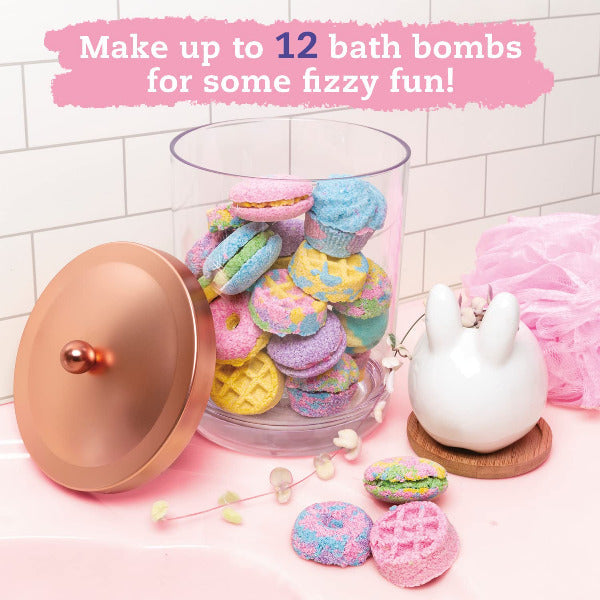 Colorful bath bombs in a glass jar with decorative elements on a tiled bathroom floor.