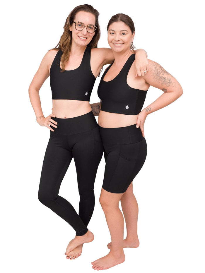 Model: Laura (left) is 5'11", 150lbs, 34B, and wearing a size M top and M shorts. Camilla (right) is 5'8", 180 lbs, 36B and wearing a size L shorts and L top.
