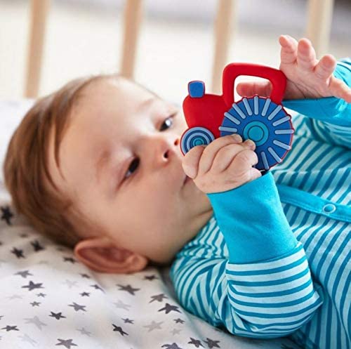 Clutching Tractor Teether