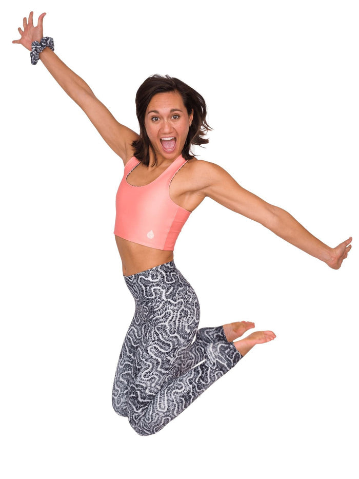 Model: Remedy is an avid freediver, Olympian, and coral restoration scientist. She is 5'7", 130lbs, and is wearing a size S Reversible Top and XS Legging.