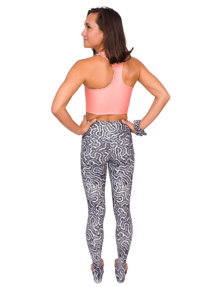 Model: Remedy is an avid freediver, Olympian, and coral restoration scientist. She is 5'7", 130lbs, and is wearing a size S Reversible Top and XS Legging.