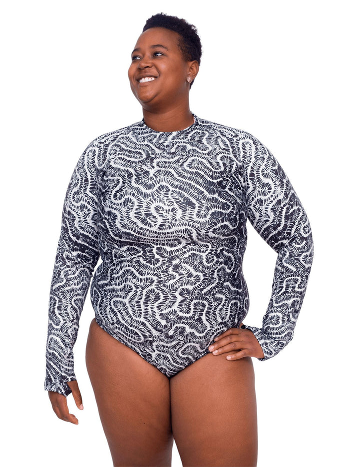 Model: Candace is a PhD candidate in the Predator Ecology & Conservation Lab at FIU and the first Bahamian scientist dedicated specifically to shark research. She is 5'9", 230 lbs, and is wearing a 2XL Sun Suit.