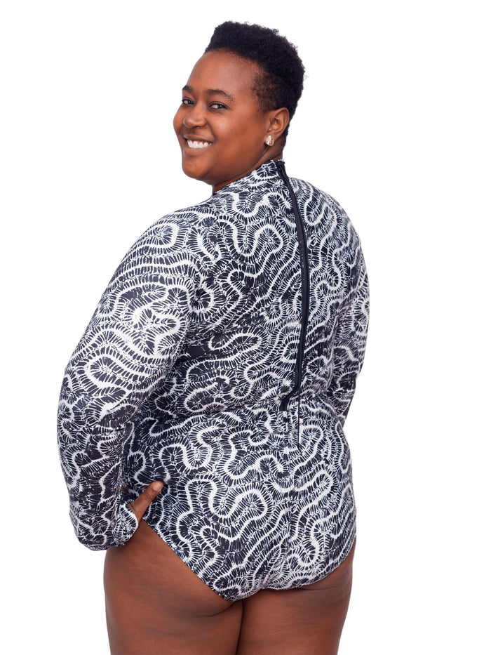 Model: Candace is a PhD candidate in the Predator Ecology & Conservation Lab at FIU and the first Bahamian scientist dedicated specifically to shark research. She is 5'9", 230 lbs, and is wearing a 2XL Sun Suit.