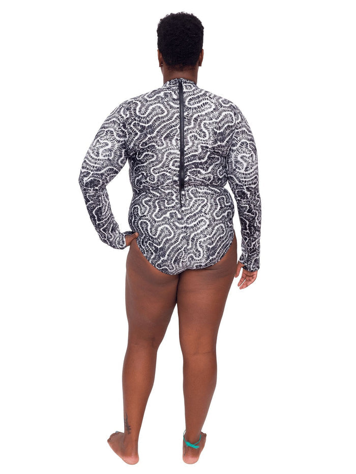 Model: Candace is a PhD candidate in the Predator Ecology & Conservation Lab at FIU and the first Bahamian scientist dedicated specifically to shark research. She is 5'9", 230 lbs, and is wearing a 2XL Sun Suit.