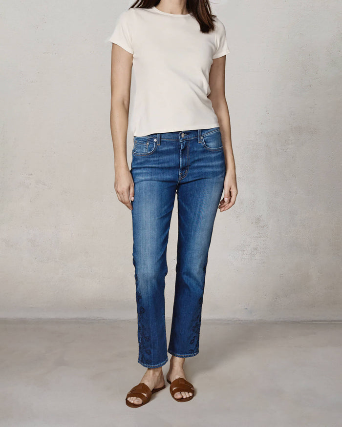 EDWIN USA embroidered denim jeans for women in blue, styled with a simple top and sandals.