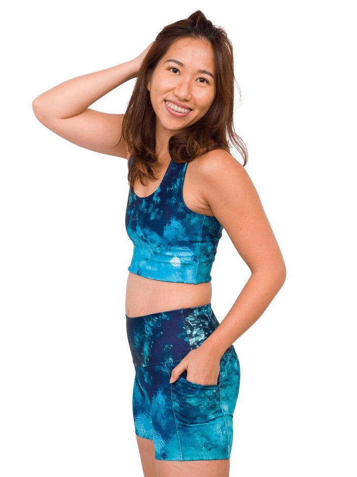 Model: Laura is a hurricane researcher and avid scuba diver. She is 5'3", 120lbs, 34B and is wearing a S short and S top.