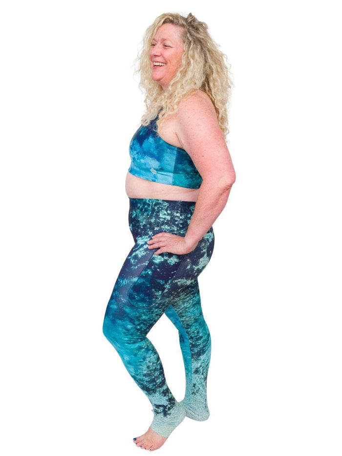 Model: Ruth volunteers for citizen science projects on both salt and freshwater fish and spends as much time as possible in, on, or under the water. She is 5'7", 217 lbs, 40DD and is wearing a 2XL top and legging.