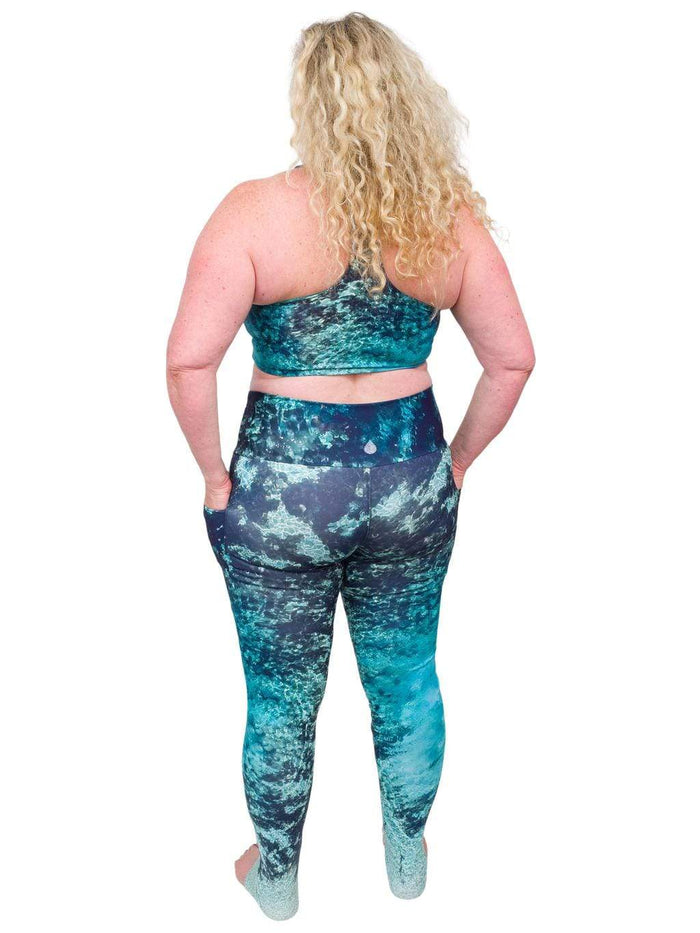 Model: Ruth volunteers for citizen science projects on both salt and freshwater fish and spends as much time as possible in, on, or under the water. She is 5'7", 217 lbs, 40DD and is wearing a 2XL top and legging.