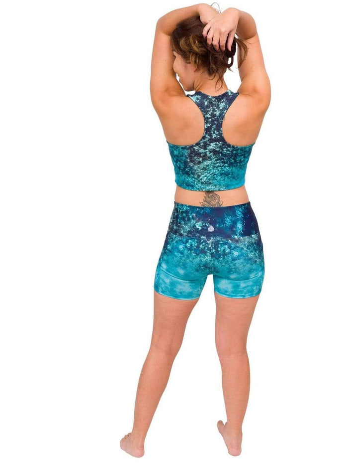 Model: Laura is a hurricane researcher and avid scuba diver. She is 5'3", 120lbs, 34B and is wearing a S top and shorts.
