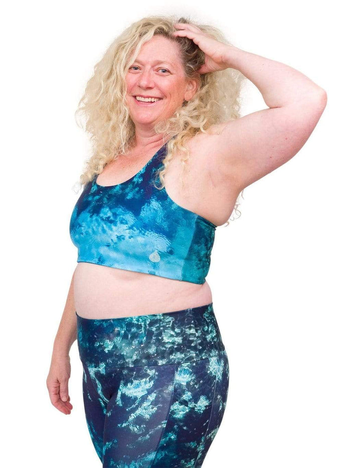 Model: Ruth volunteers for citizen science projects on both salt and freshwater fish and spends as much time as possible in, on, or under the water. She is 5'7", 217 lbs, 40DD and is wearing a 2XL top and legging.