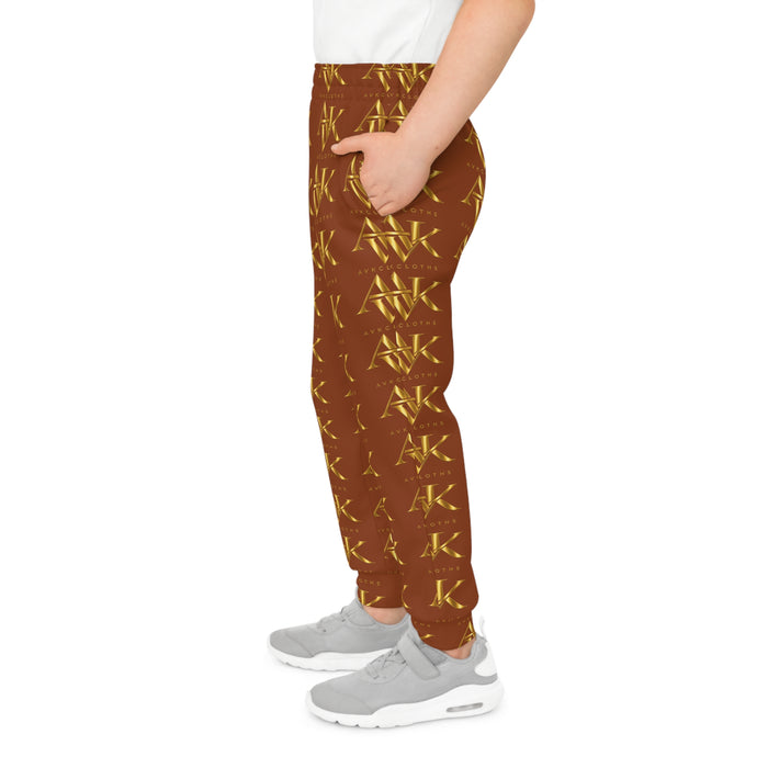 Golden Monogram Youth Joggers — All-Over Brown & Gold Logo Sweatpants
