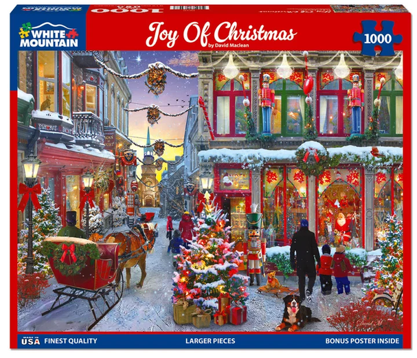 White Mountain 1000-piece jigsaw puzzle featuring a festive Christmas street scene with decorated storefronts, Christmas trees, sleighs, lights, and people on a snowy cobblestone street.
