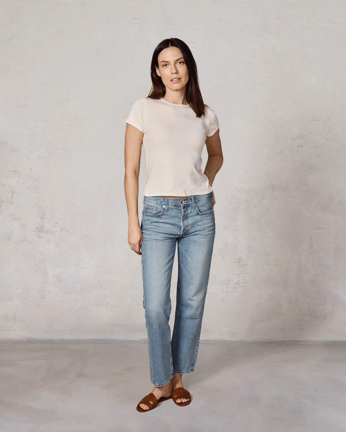 EDWIN USA model in American made women's straight leg jeans light wash with white tee and sandals