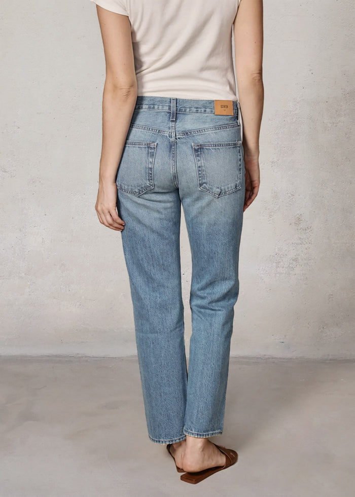 EDWIN USA back view of model wearing American made women's straight leg jeans in light wash with white tee