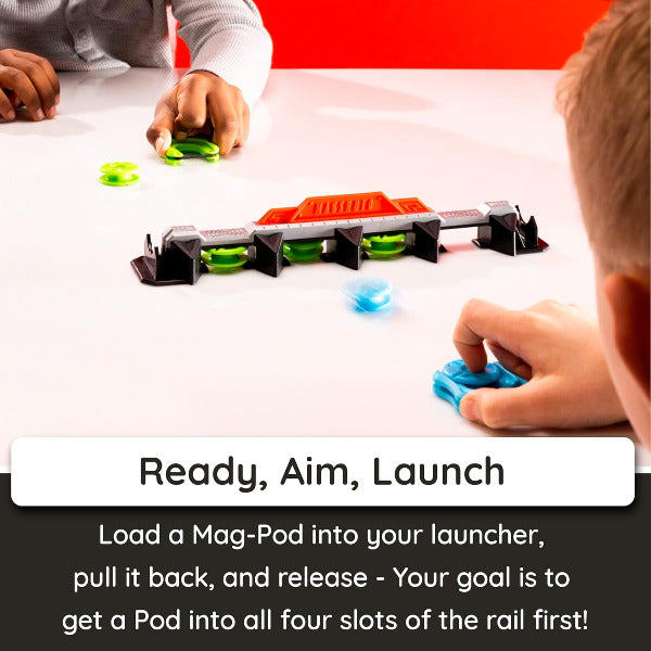 Children playing with a toy set on a table, with text 'Ready, Aim, Launch' displayed.