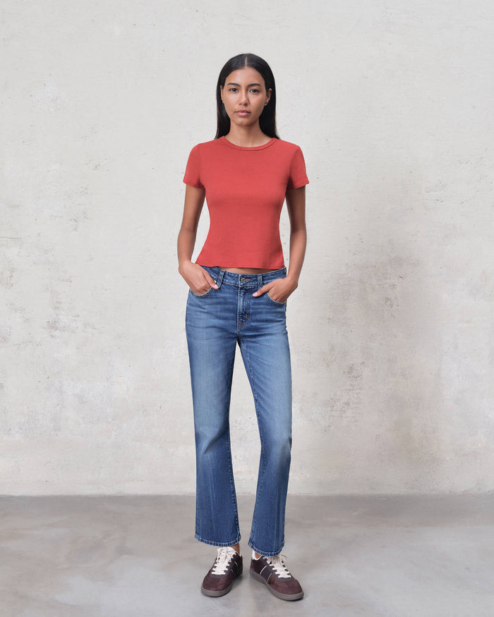 EDWIN USA premium ankle bootcut denim jeans on female model wearing red tee and sneakers