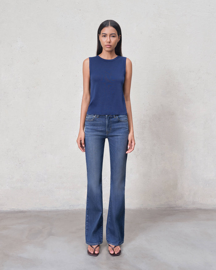 EDWIN premium bootcut denim jeans mid wash on model with high rise waist and flattering flare for everyday wear