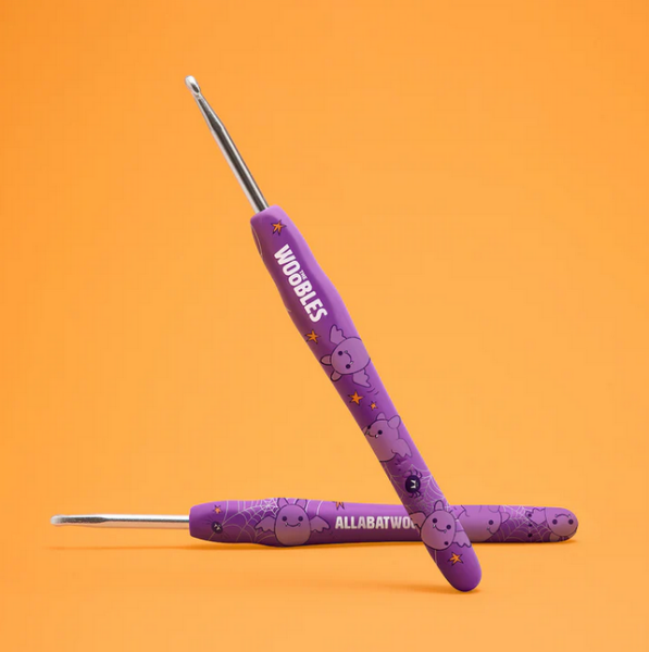 Purple crochet hook with bat character design