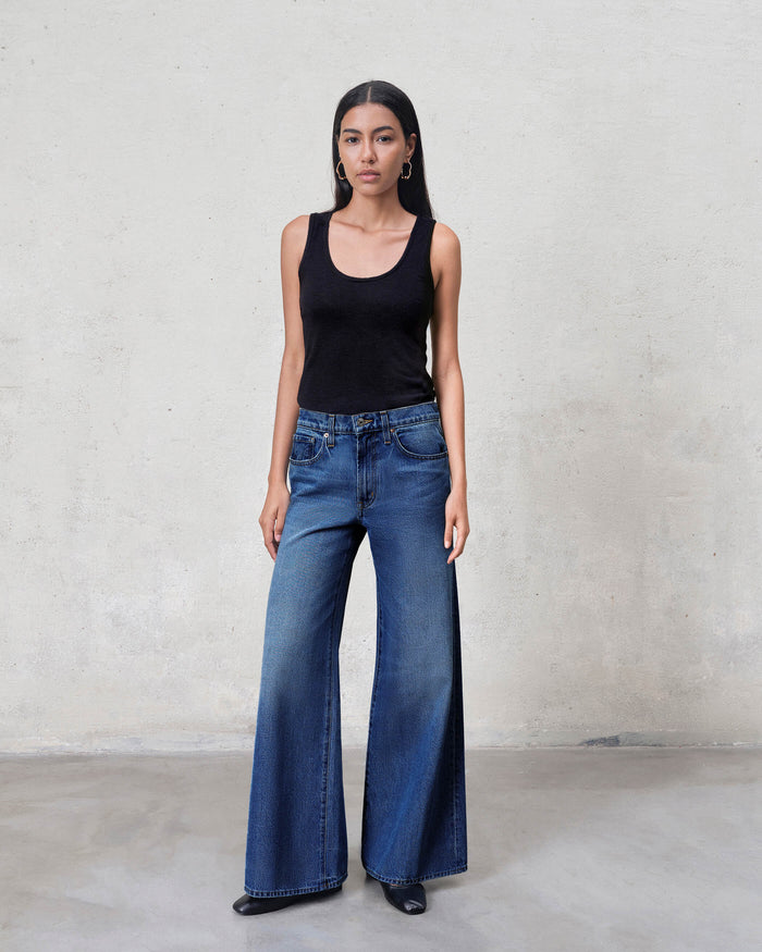 EDWIN high rise wide leg jeans made in USA modeled in dark wash on woman wearing black tank top