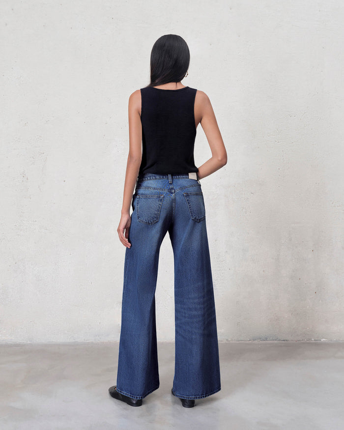 EDWIN jeans back view on model showing high rise wide leg jeans made in USA in dark wash