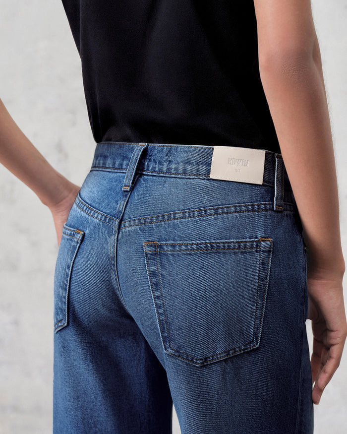 EDWIN high rise wide leg jeans made in USA rear view on model in dark wash with leather brand patch