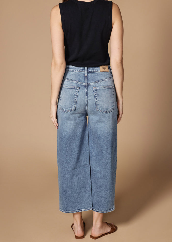 Back view of women's cropped straight leg jeans by EDWIN USA in light blue denim