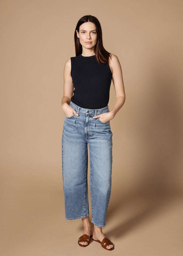EDWIN USA women's cropped straight leg jeans in light wash worn with black sleeveless top and brown sandals
