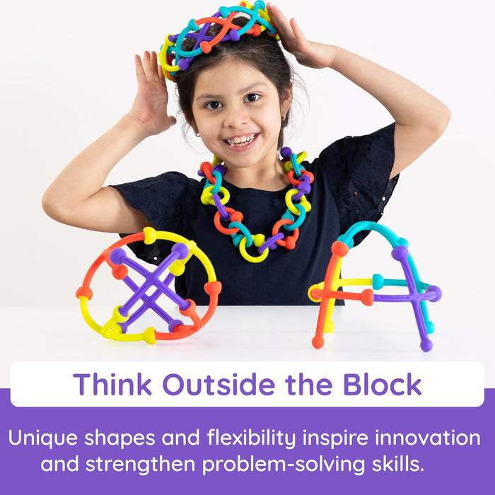 Child wearing colorful toy headbands with text 'Think Outside the Block' on a white background