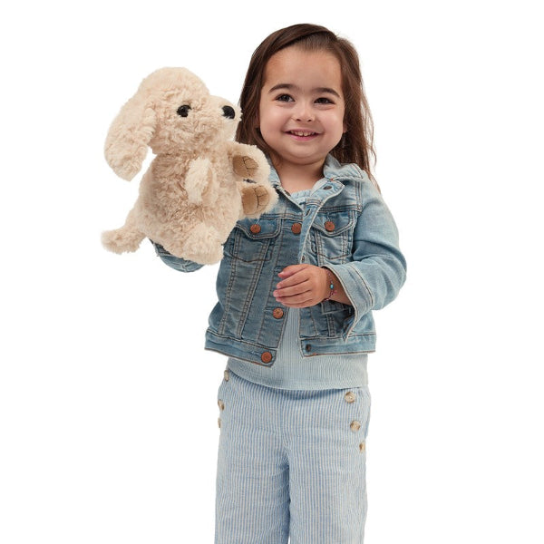 A young child puppeteering a puppy dog puppet.