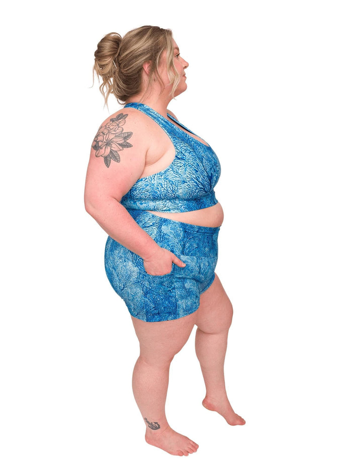 Model: Chelsea is a marine conservationist who believes that science is for everybody… and every BODY! She is 5'2", 230 lbs, 40DD and is wearing 3XL shorts and a 3XL reversible top.