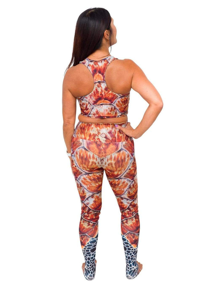 Model: Donna is a yoga teacher whose goal is to empower her students by using yoga to create deeper connections with themselves and with nature. She is 5'2", 125 lbs, 34B and is wearing a S top and legging.