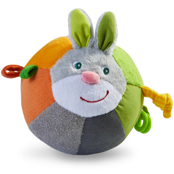 Colorful plush toy with a rabbit design on a white background