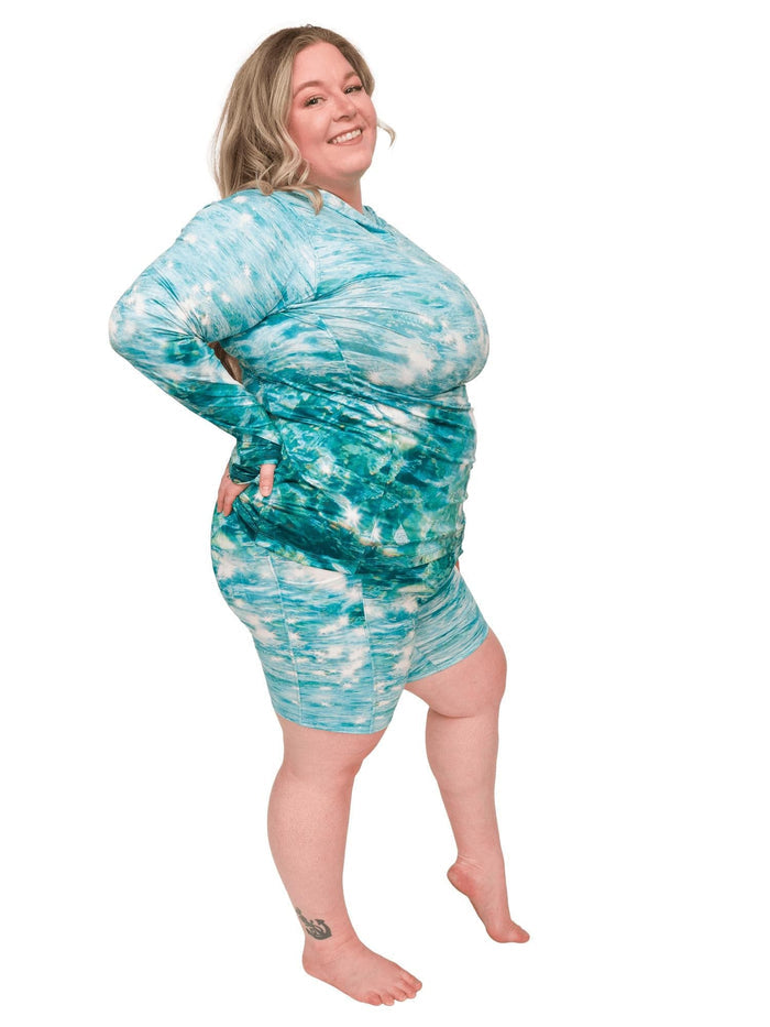 Model: Chelsea is a marine conservationist who believes that science is for everybody… and every BODY! She is 5'2", 230 lbs, 40DD and is wearing 3XL shorts and sun shirt.