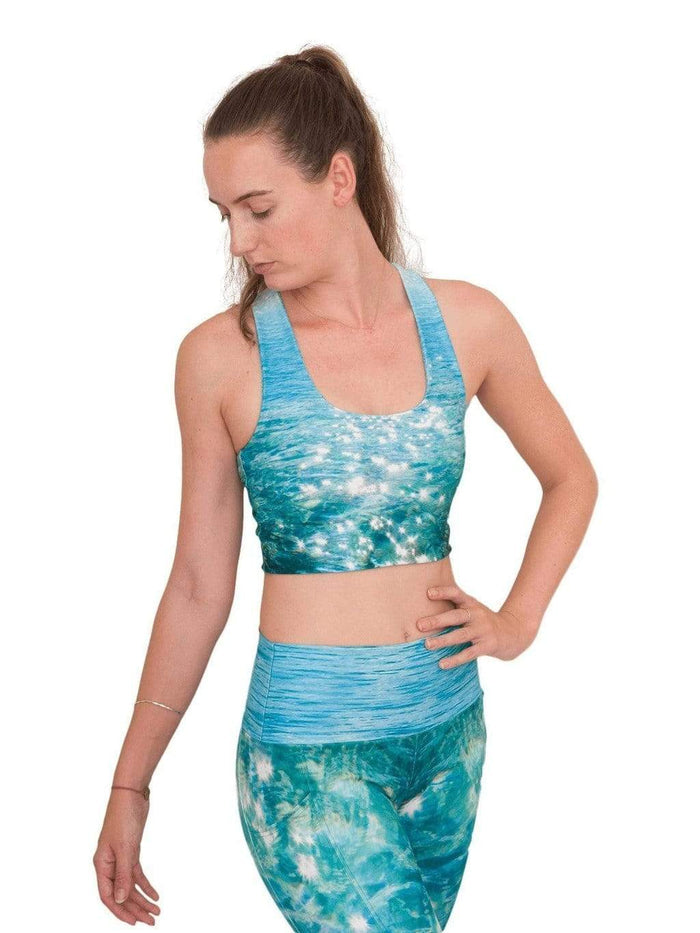 Model: Laura is our Chief Product Officer at Waterlust, a scuba diver, kiter and recreational yogi. She is 5’10, 147 lbs, 34B and is wearing a S top and M legging.