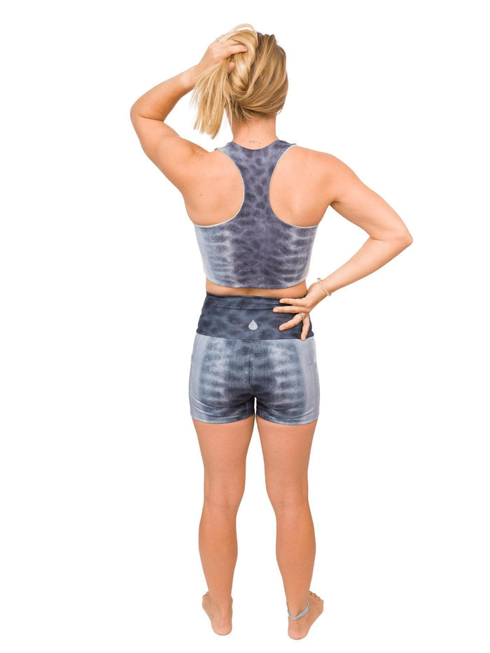 Model: Erin is a coral ecologist and Program Manager here at Waterlust. She 4'11", 110 lbs, 32A and is wearing an XS short and XS top.