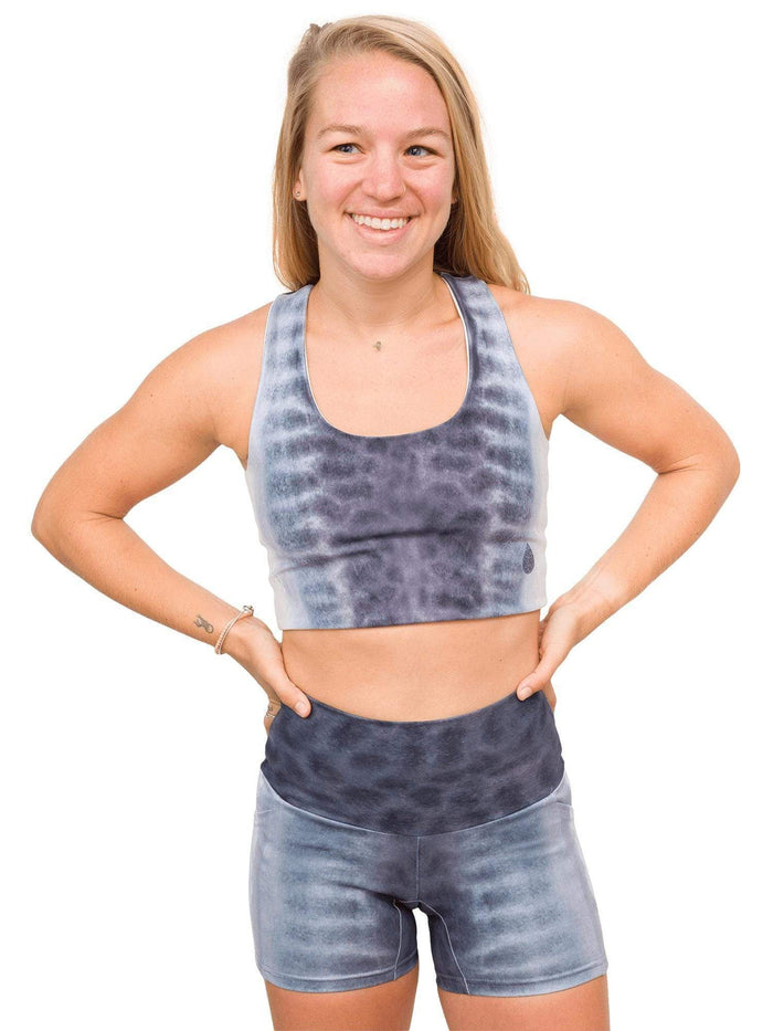 Model: Erin is a coral ecologist and Program Manager here at Waterlust. She 4'11", 110 lbs, 32A and is wearing an XS short and XS top.